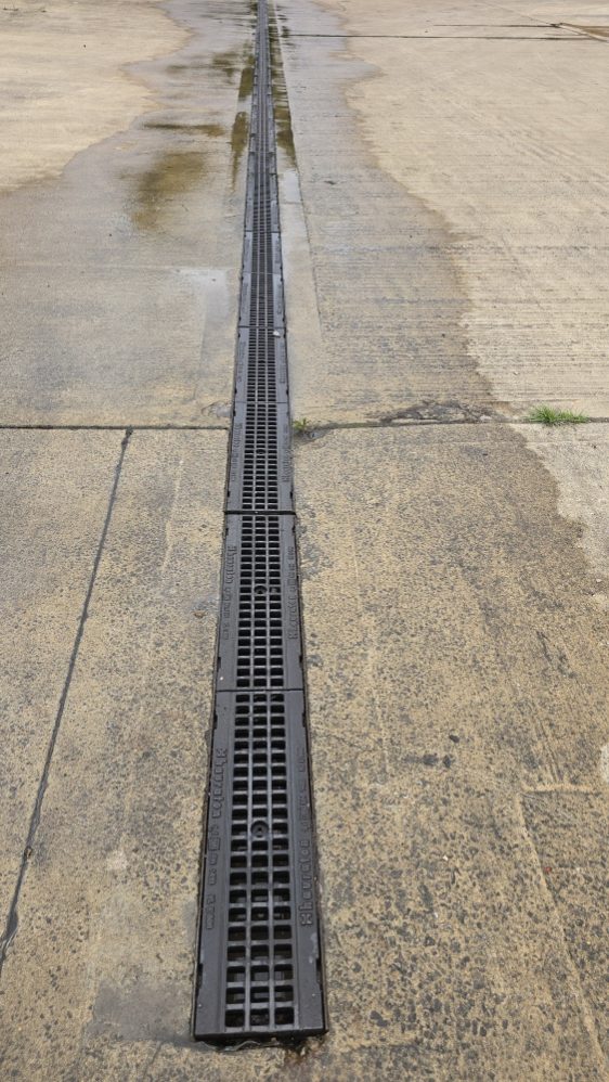 Wet concrete with tire tracks