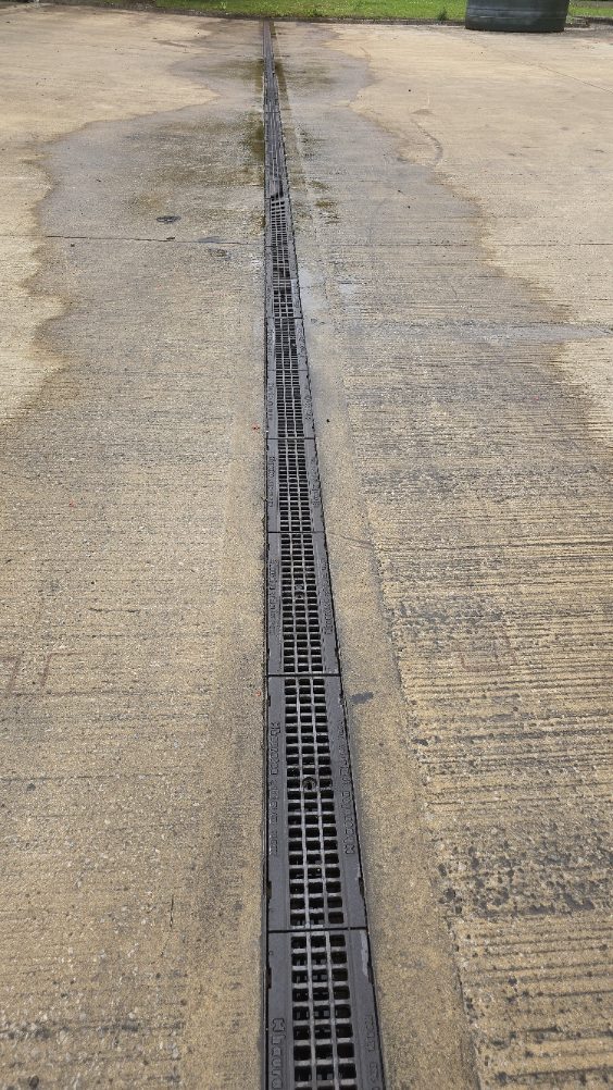 Drainage grate on pavement