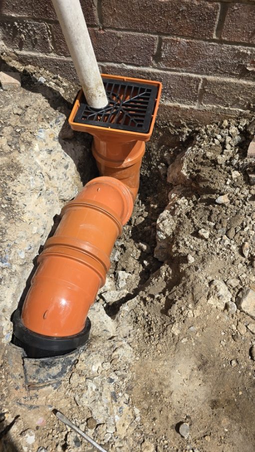Orange drainage pipes installation